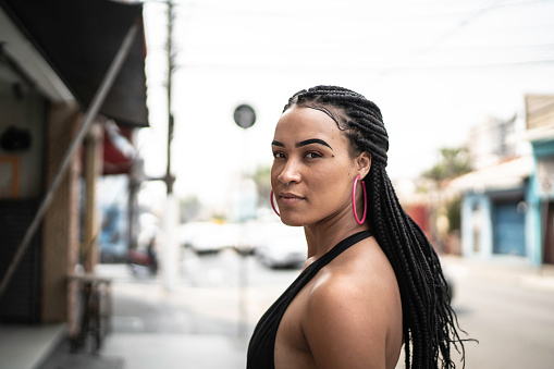 Portrait of a young confident woman in the city