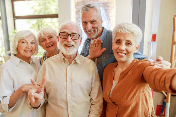 istock Joyful senior people making selfie in cafe 1176561878