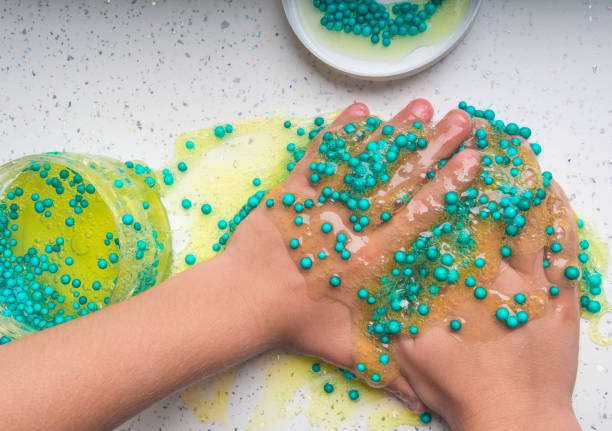 istock Kid Playing Hand Made Toy Called Slime, selective focus 1176561880