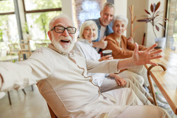 istock Cheerful old people making selfie in cafe 1176561900