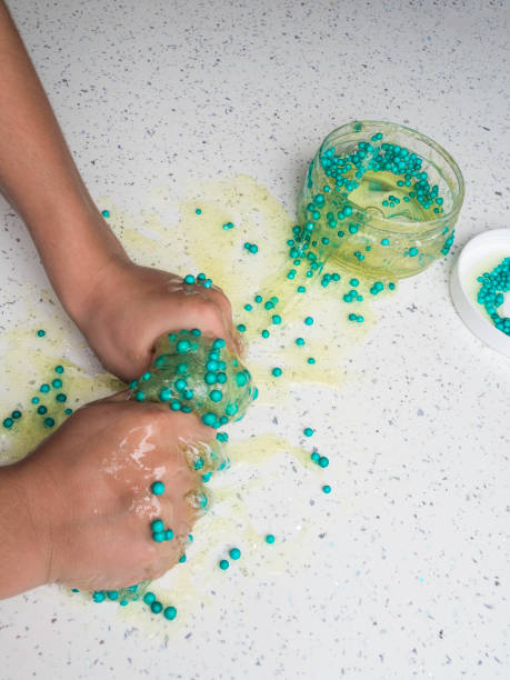 istock The child playing slime in happy time, selective focus 1176561907