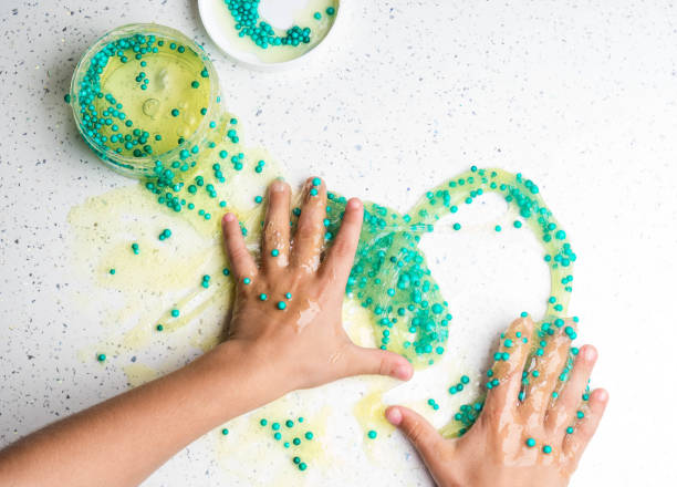 istock The child playing slime in happy time, selective focus 1176561913