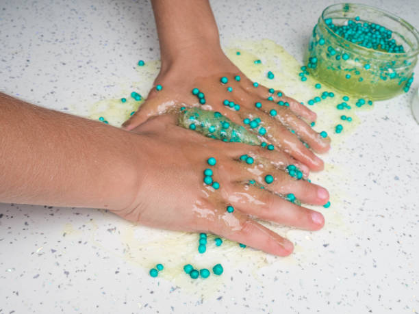 istock Games mucus in child hand on a white background 1176561988