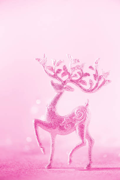 istock Silver glitter Christmas deer on neon pink background with lights bokeh, copy space. Greeting card for new year party. Festive holiday concept. Banner 1176562087