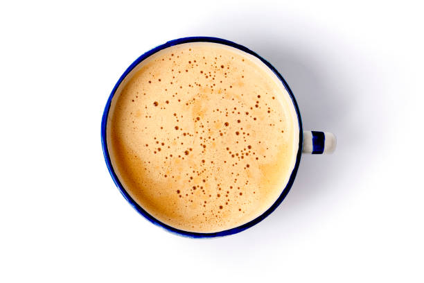 большая чашка кофе с пеной на белом фоне - coffee nobody macro directly above стоковые фото и изображения