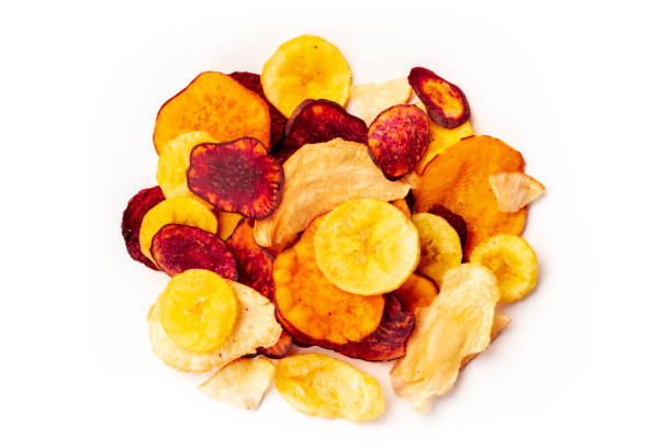 istock Dry fruit and vegetable chips, healthy vegan snack, a mixed heap on a white background 1176567429
