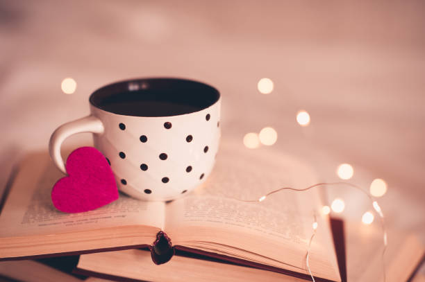 istock Cup of tea on books 1176568147