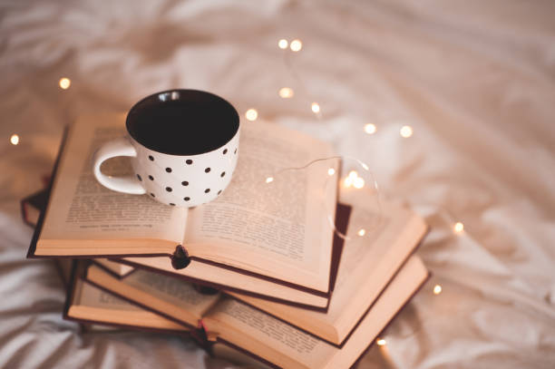 istock Cup of tea on books 1176568161