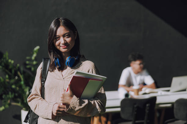 istock Happy beautiful female student is ready for studying 1176570910