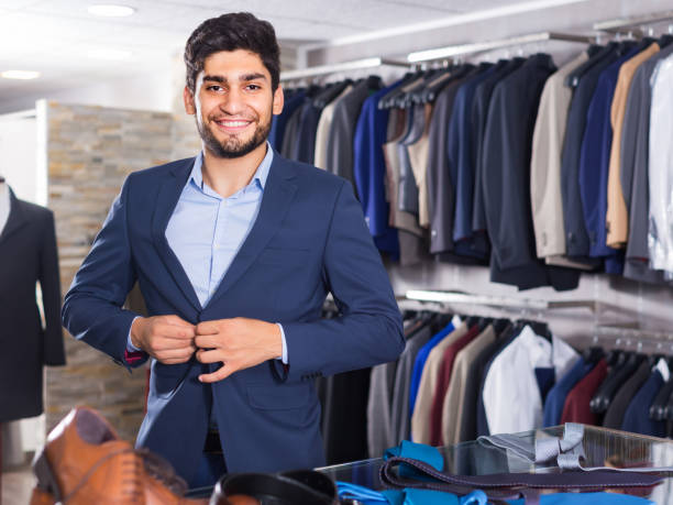 istock Adult guy is trying on jacket 1176572716