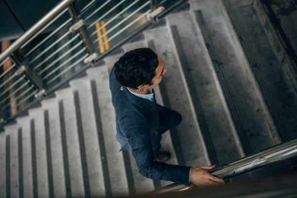 Gentleman walking up the steps downtown in Taipei