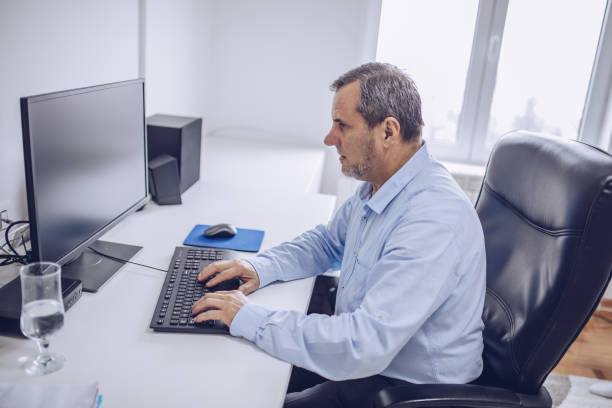 istock A businessman uses a computer in an office 1176573900