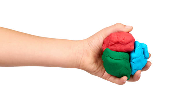istock Children hand with color plasticine, kids educational toy. 1176575896
