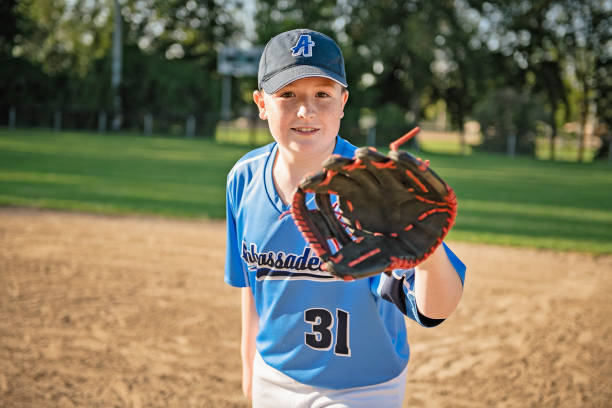 A children baseball players standing on the playground
