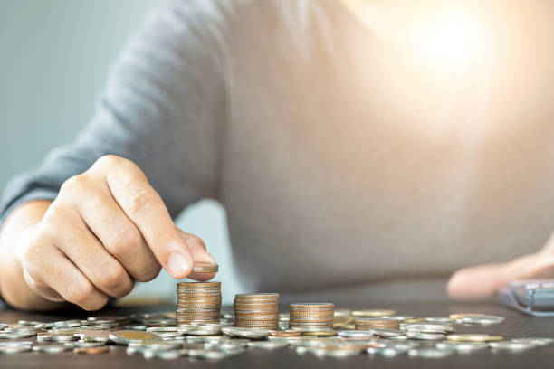 istock Man hand putting coins stacking for growth business and saving investment concept. 1176579232