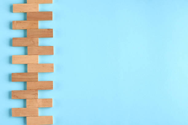 istock Brown wooden blocks idea on blue background composition. 1176579481
