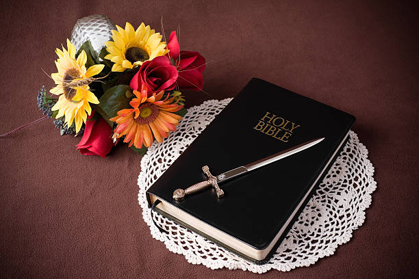Holy Bible, Sword and Flowers  artificial flower stock pictures, royalty-free photos & images
