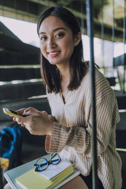 istock Happy Asian lady looking at camera indoors 1176582544