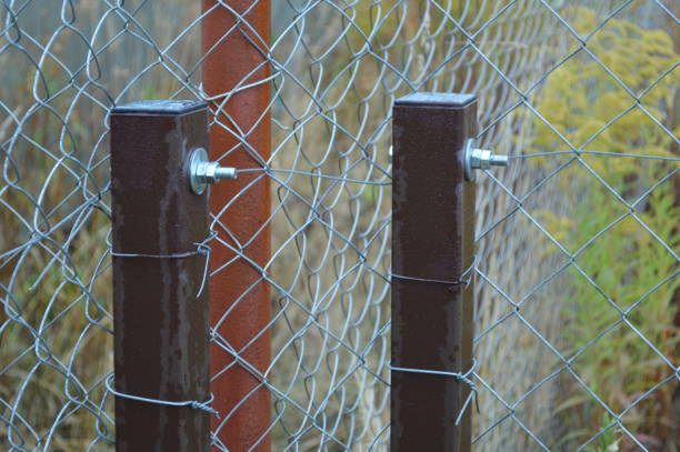 istock Barbed wire stretched on a fence for security 1176583854