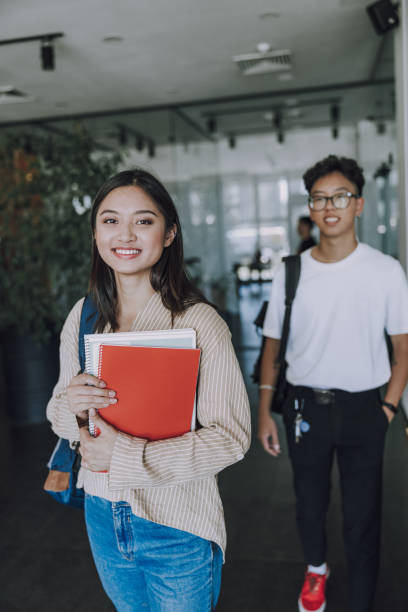 istock Asian students are walking in coffee house 1176584145