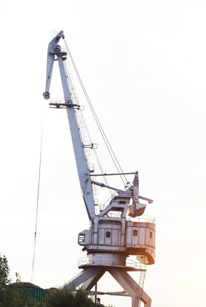 Large port crane with bucket for loading, unloading Large Port Crane, cargo transportation mechanical import big blue crane stock pictures, royalty-free photos & images