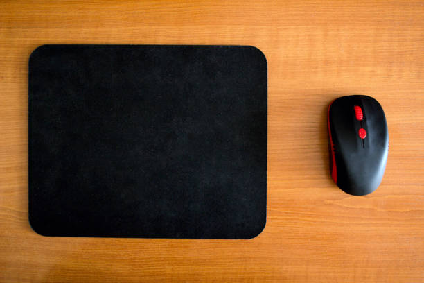 computer mouse on mouse pad isolated on white background