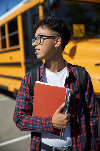 istock Male young student is looking away outdoors 1176587735