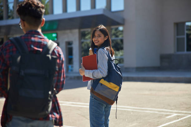 istock Happy Asian girl with backpack walking to school 1176587882