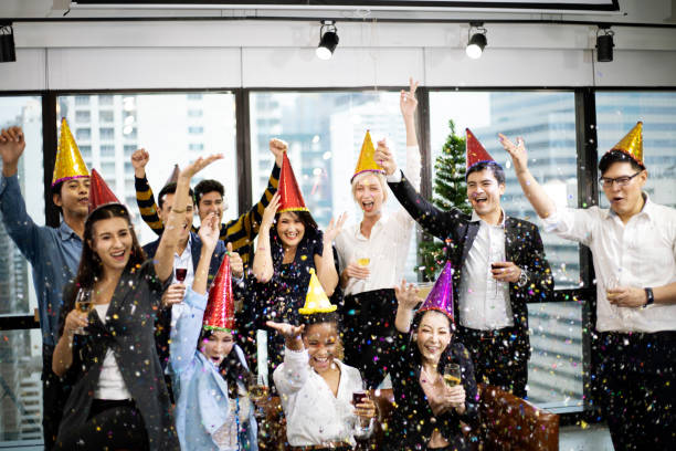 Joyful business team happy new year party and Christmas celebration in the offices. stock photo