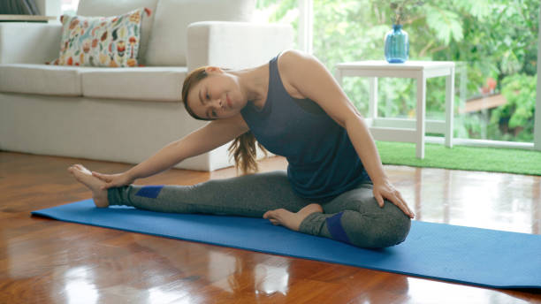 istock Asian Mother Practicing Yoga With Her Daughter 1176591622