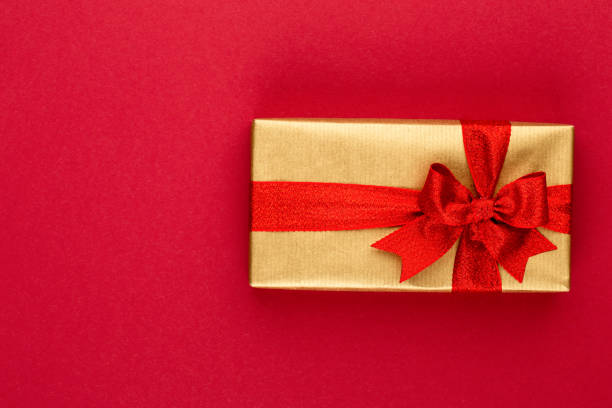 istock Christmas, holiday present box on red background. 1176594664
