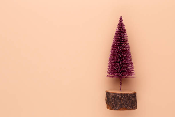istock Christmas tree on pastel colored background. Christmas or New Year minimal concept. 1176594805
