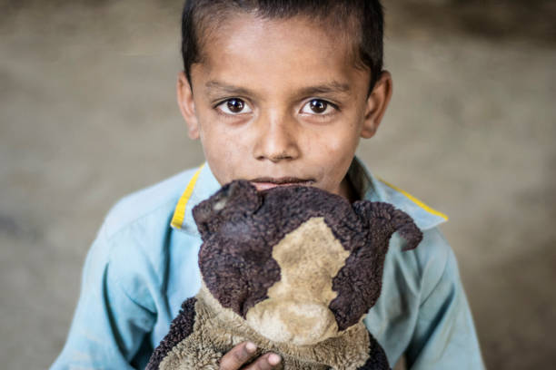 a young sick child suffering from cancer and still smiling