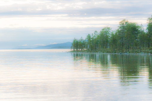 Romantic, mysterious lake view very early in the morning. Photo was made near the Norwegian - Swedish border: Lake Femunden