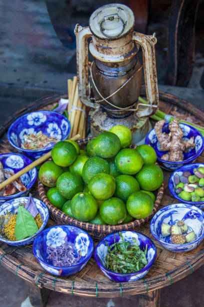 mot hoi n is a special herbal tea. its famous of herbal drink with lime and lotus petals. - lime market vietnam fruit imagens e fotografias de stock