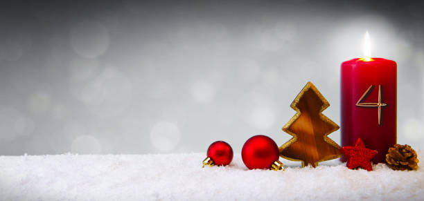 istock Fourth Advent.Christmas background with Advent candle and red decoration. 1176598591