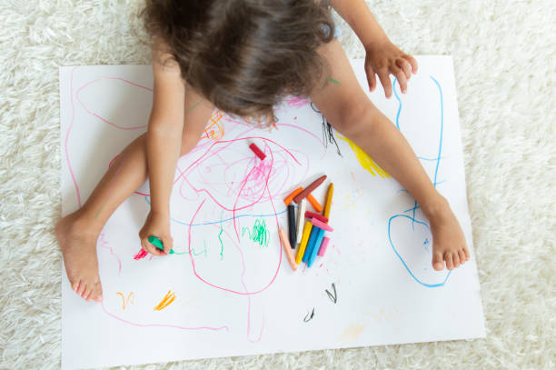 istock Little girl drawing 1176598794