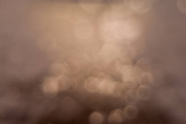 istock glitter vintage lights background. dark gold and brown. 1176599913