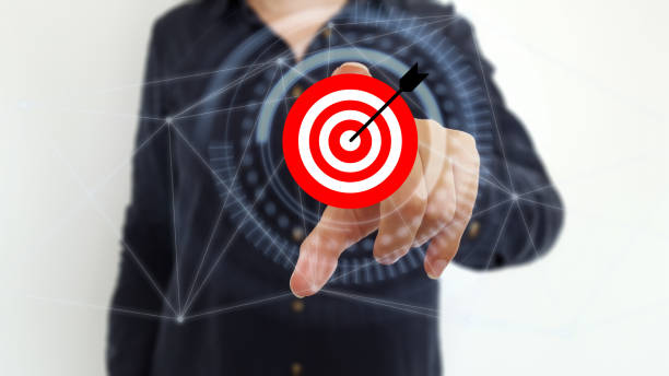 istock Businesswoman using target and arrow on digital interface 1176600027
