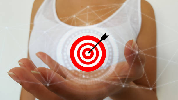 istock Businesswoman using target and arrow 1176600033