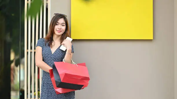 Portrait shot asian shopping woman stand on shopping lable.