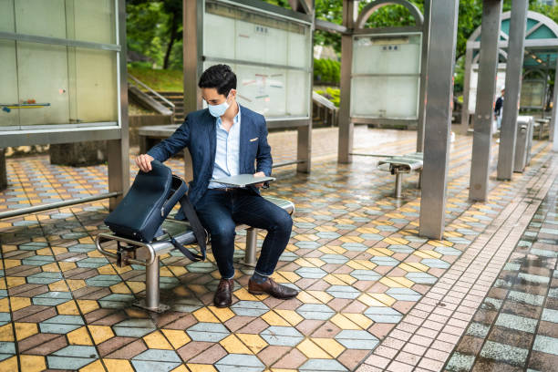 istock Finishing some work while waiting for a bus on station 1176601748