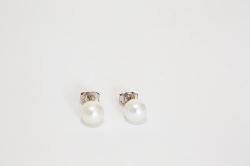 White pearl pieced earrings pair fine jewelry isolated on white - Image
