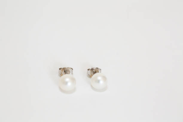 White pearl pieced earrings pair fine jewelry stock photo