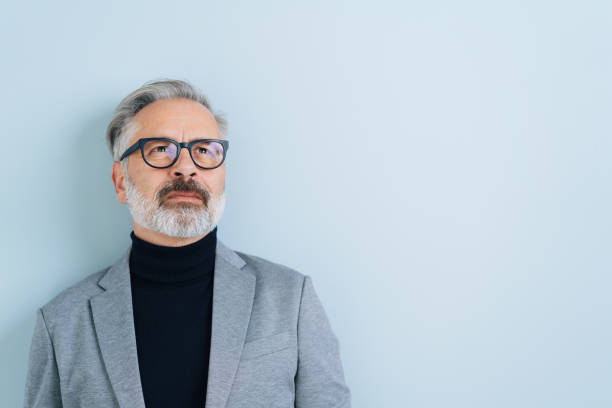 istock Thoughtful bearded man wearing glasses 1176602090