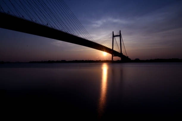 istock Sunset at 2nd Hooghly Bridge Kolkata 1176603724