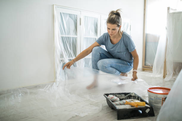 istock Woman doing diy project in apartment 1176604080