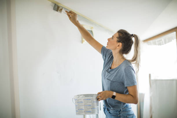 istock Woman doing diy project in apartment 1176604207