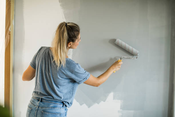 istock Woman doing diy project in apartment 1176604244