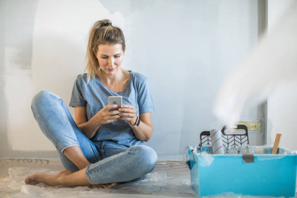 istock Woman doing diy project in apartment 1176604245